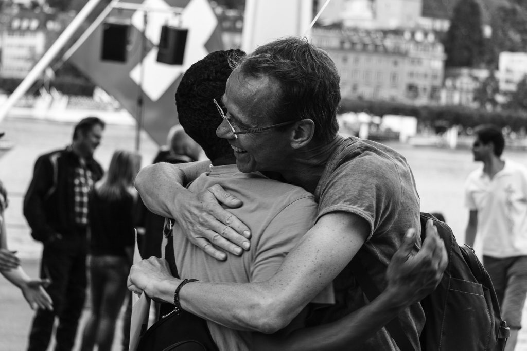Two people hugging in black and white